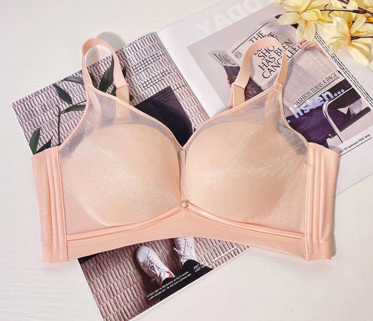 Angled view of grey wireless mesh contour bra highlighting wide smoothing sidebands