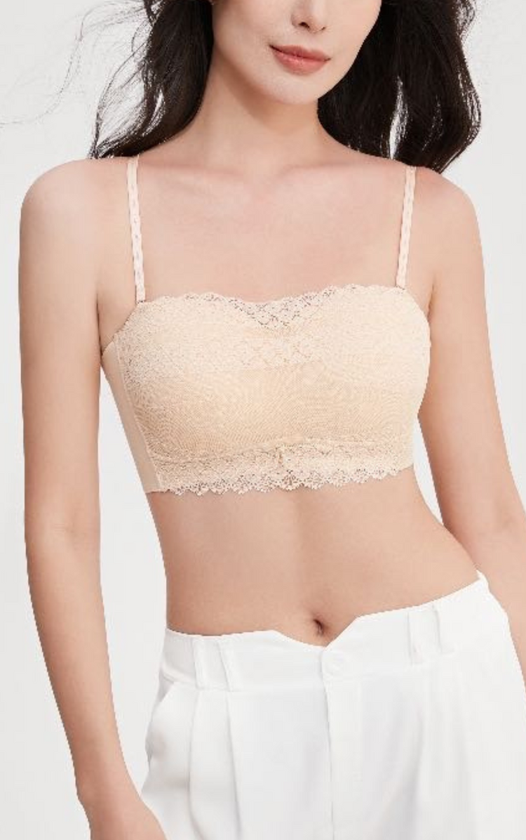 Woman wearing a beige Chic Allure Seamless Tube Top Wireless Bralette with adjustable shoulder straps and wide sidebands, side view.