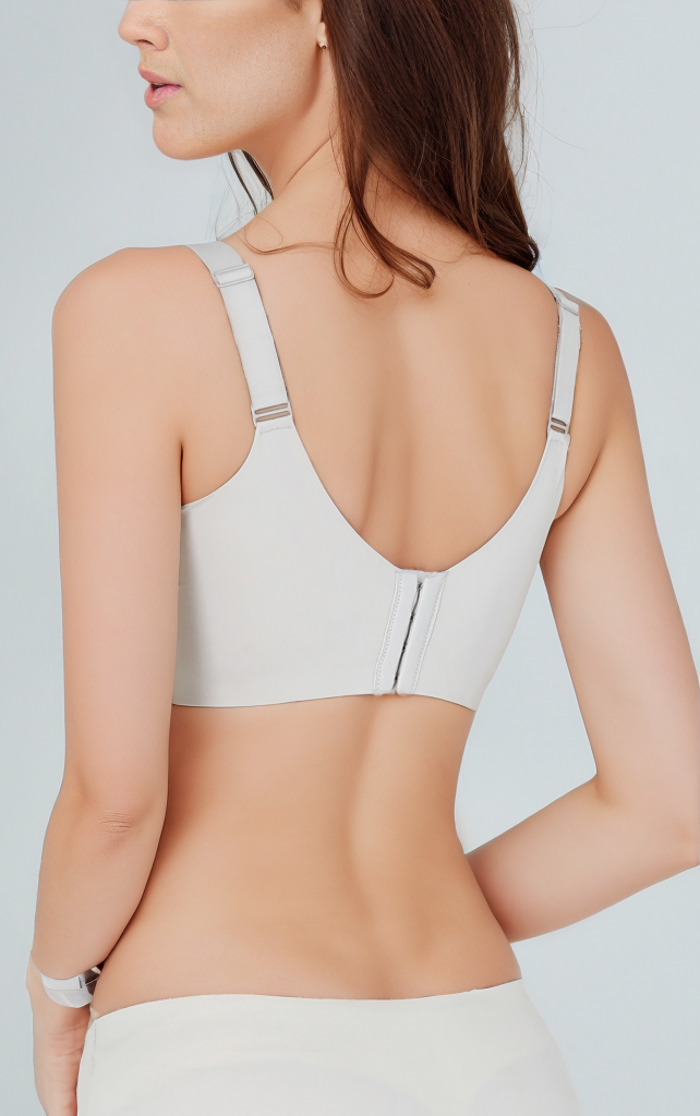Back view of the Delicate Allure French Style Lace Wireless Push-Up Bra in white, highlighting the adjustable shoulder straps, worn by a model.