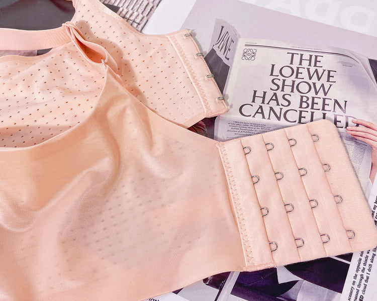 Close-up of the back of the Ultimate Comfort Seamless Bra in beige, illustrating the wide sidebands and adjustable hooks.