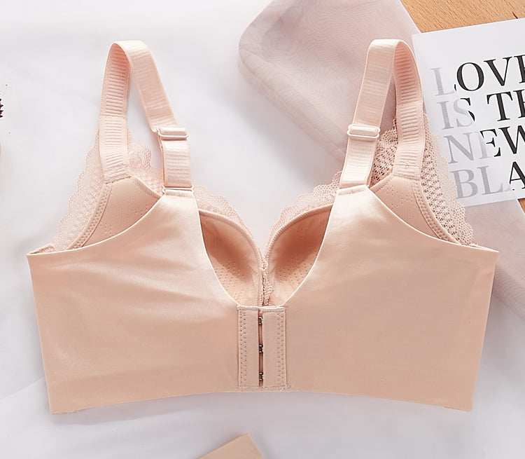 Back view of a beige push-up bra showing adjustable straps and a hook-and-eye closure with wide sidebands.