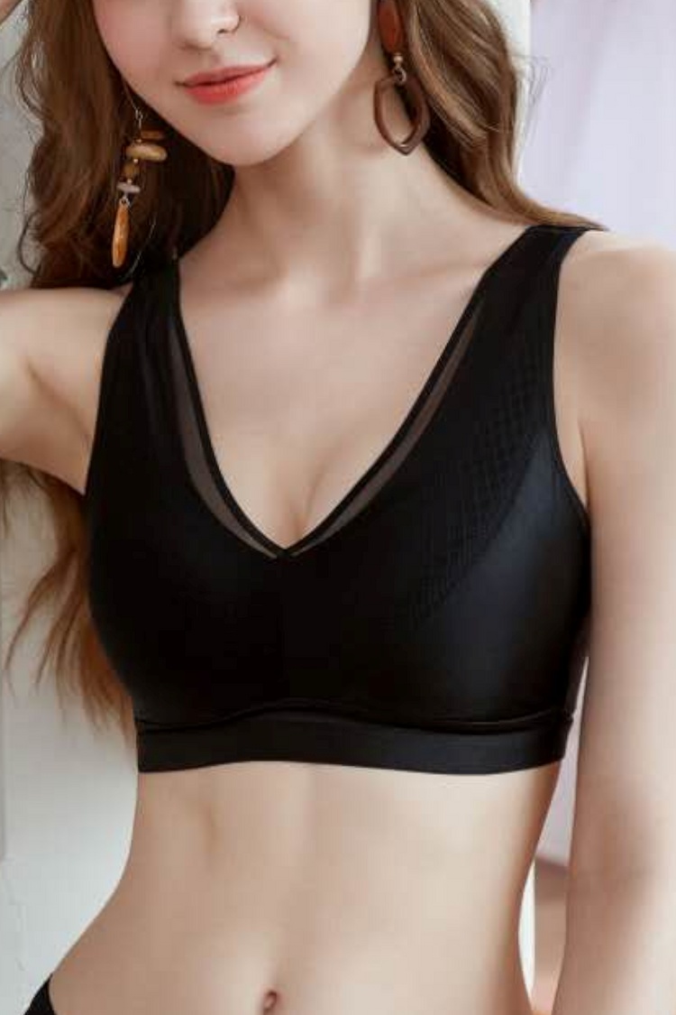 Model wearing the Satin Grace Thin Cup Wireless No-Bulge Bra in black, displaying the non-slip wide shoulder straps and supportive fit.