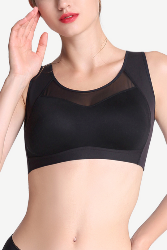 Front view of a black wireless sports bra with mesh panel, offering full coverage and breathable comfort.
