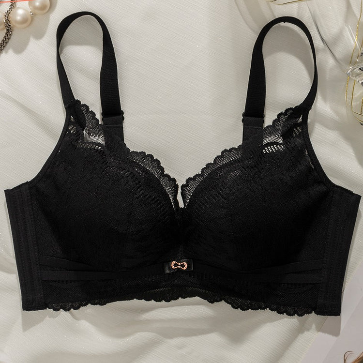 Flat lay of a black Chic Lace Wireless Push-up Bra, showcasing the intricate lace detailing and soft, supportive design on a light background.