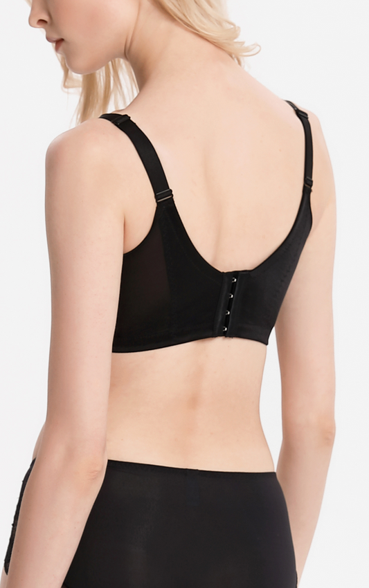 Back view of a model wearing a black wireless contour bra – showcasing the wide straps and back-smoothing effect.