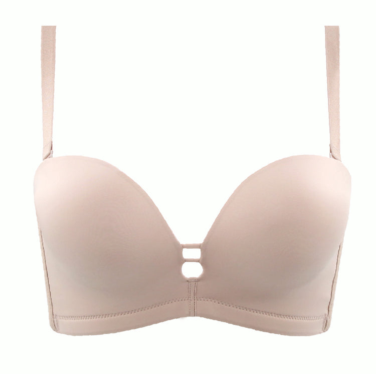 Beige ergonomic mold cup push-up bra with front keyhole detail and adjustable straps. Features a seamless design for invisible wear, offering comfort and support throughout the day.