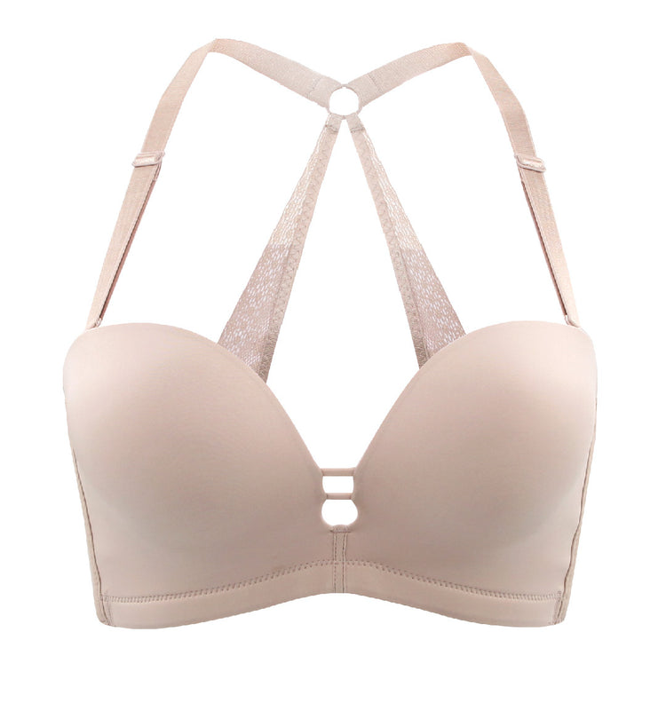 Beige seamless push-up bra showing a smooth, minimalist design with multi-way straps.