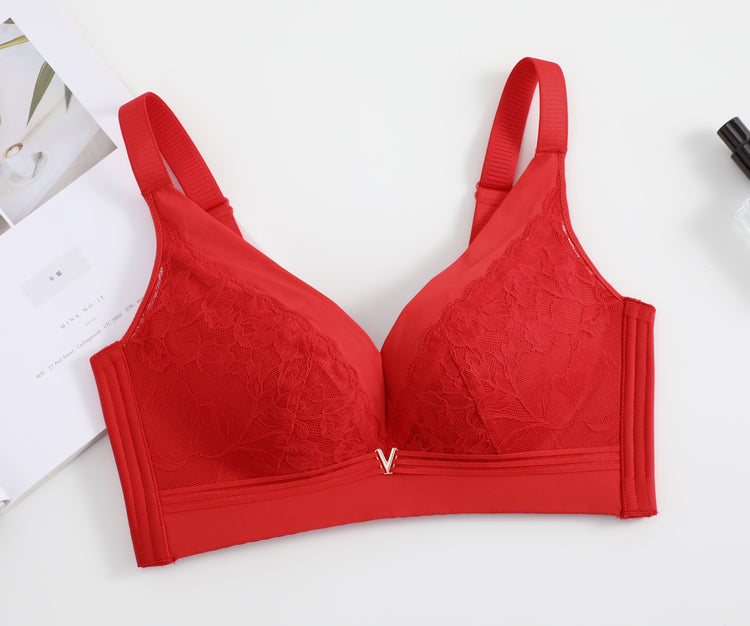 Front view of a red wireless lace push-up bra, highlighting its vibrant color, delicate lace, and seamless construction for a smooth fit.