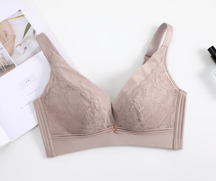 Front view of a pink wireless lace push-up bra, emphasizing its delicate lace embroidery and seamless fit for everyday comfort.