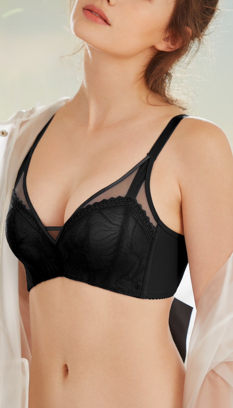Model in a black Wireless Noble Lace Push-up Bra, designed for comfort and a dramatic push-up effect without underwire.